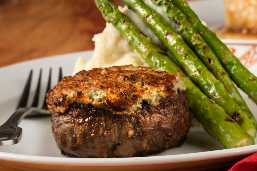 A photo of steak and asparagus with mashed potatoes