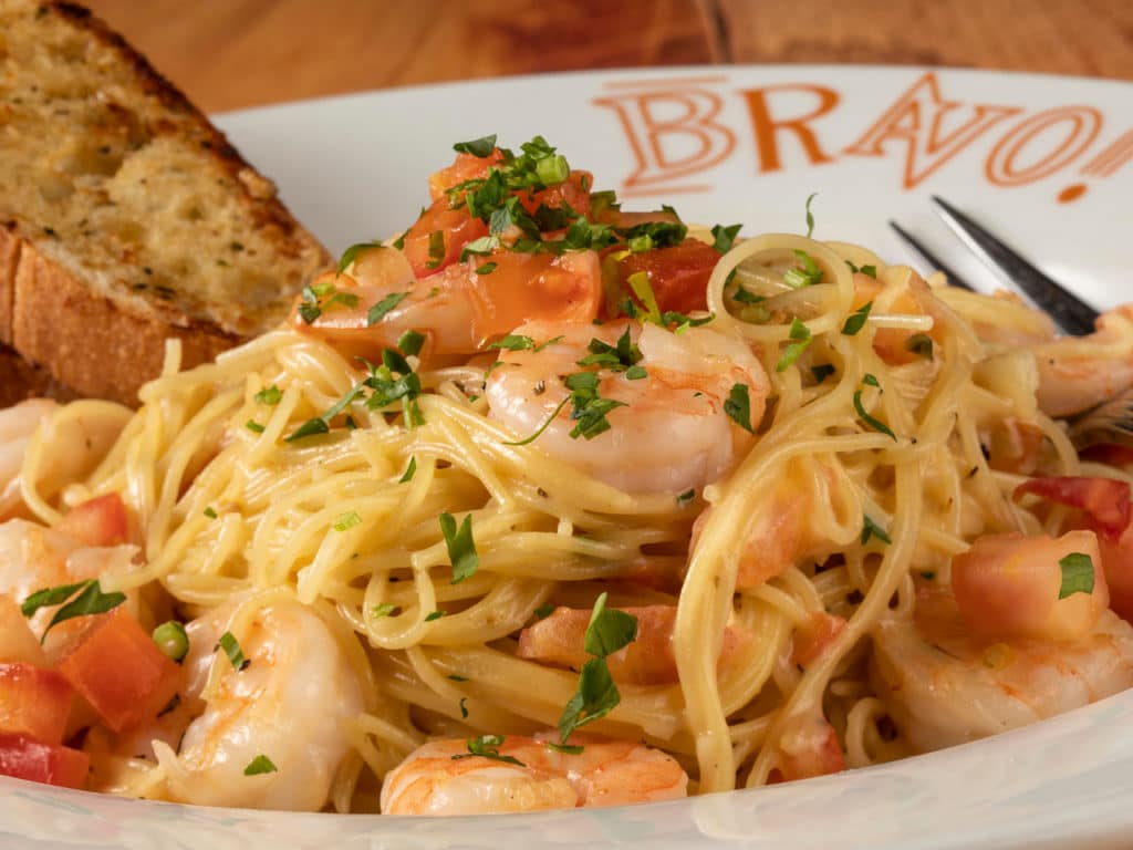 Shrimp Scampi on a plate on a wooden table