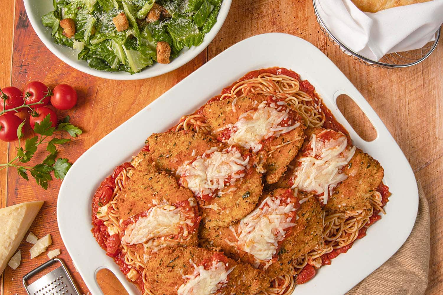 Chicken Parmesan and Caesar salad heading