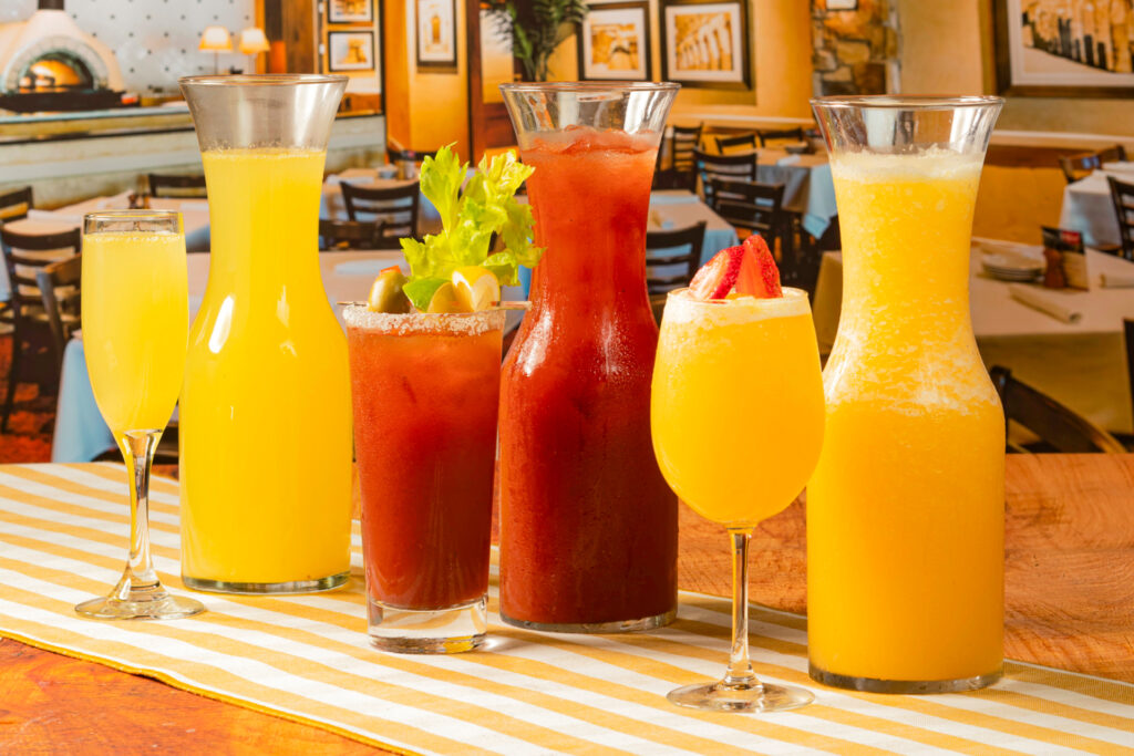 Pitchers of juice to mix with champagne.