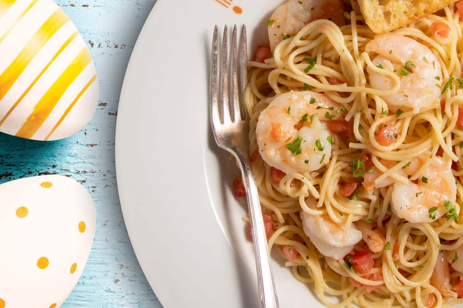 Bravo easter shrimp pasta plate with easter egg background