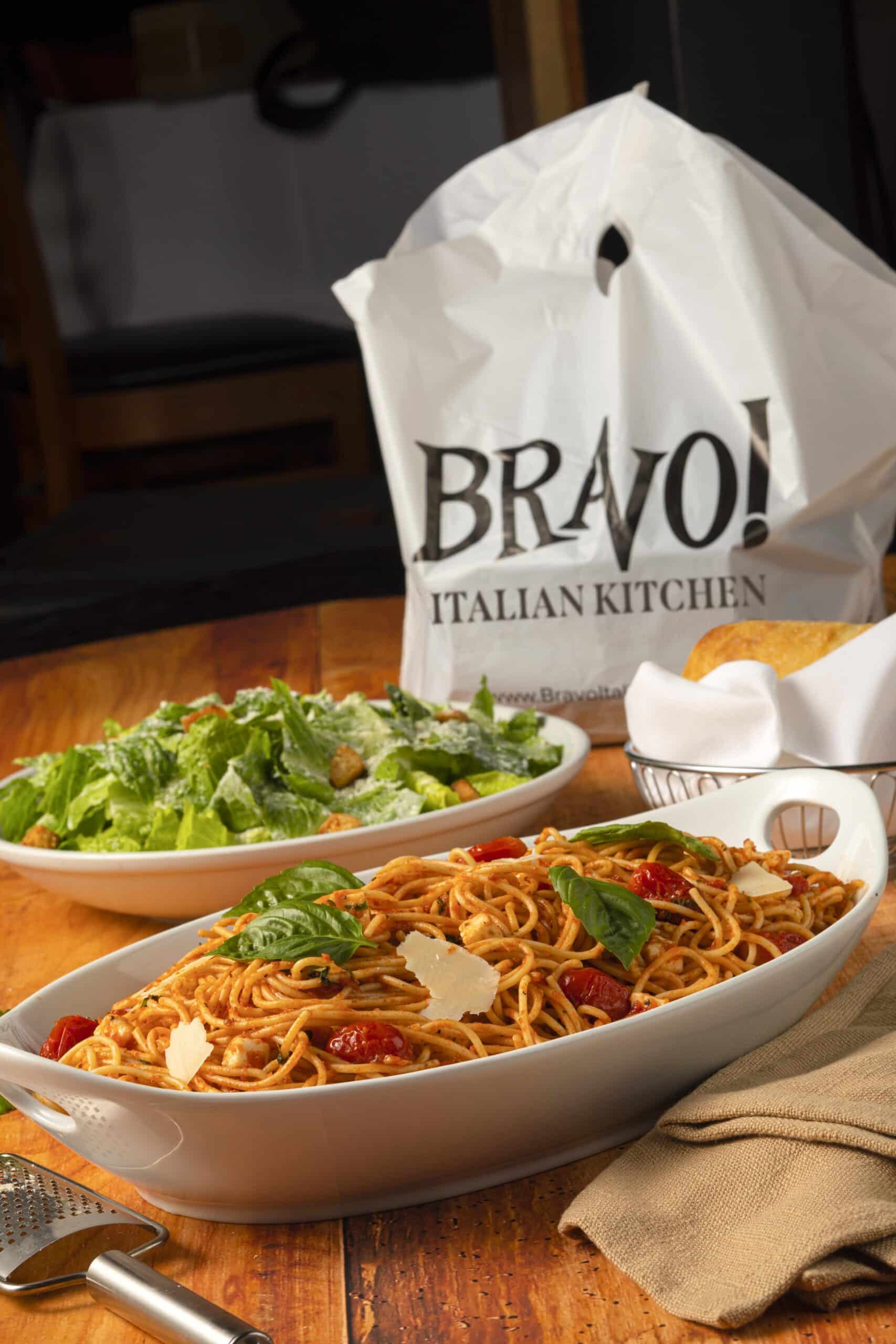 A photo of Bravo's Spaghetti Pomodoro with a take out bag