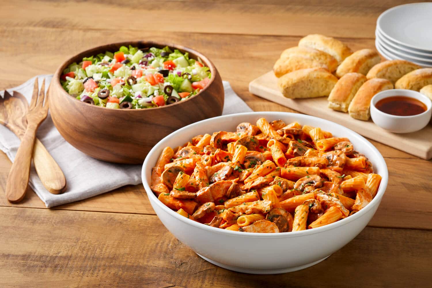 Pasta Bravo, chopped salad, and bread heading